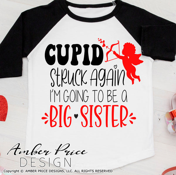 Cupid struck again SVG, Valentine's day Big sister svg, new baby valentine's day SVG, Valentine's Day pregnancy svg, Valentine's day maternity svg, free svg, shirt svg silhouette projects vector files for home decor. Silhouette SVG Files for Cricut Project Ideas Simply Crafty SVG Bundles Vector | Amber Price Design 
